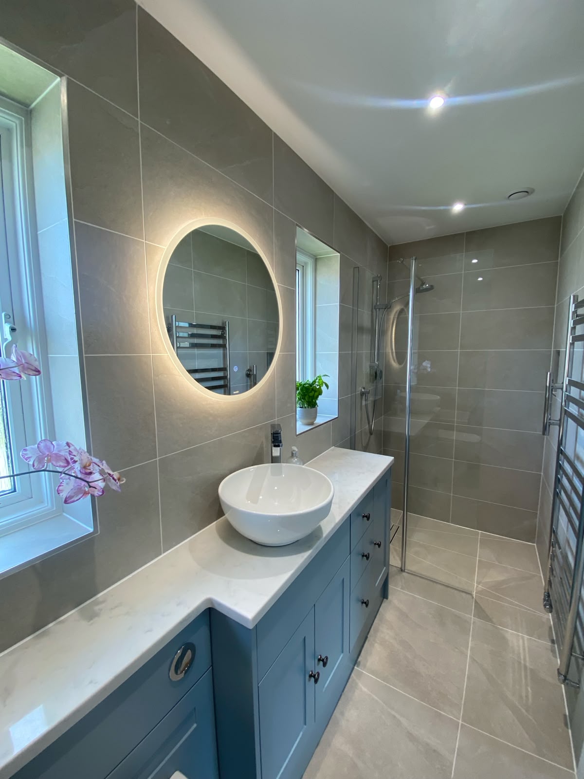 Modern updated bathroom with light up mirror
