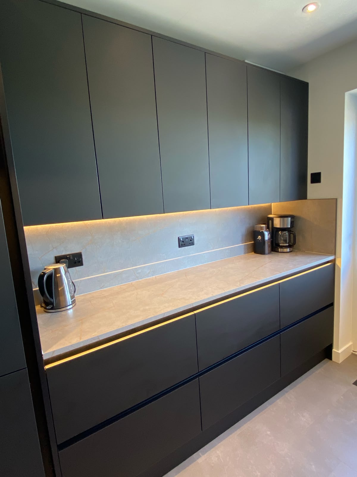 Sleek black kitchen cabinetry