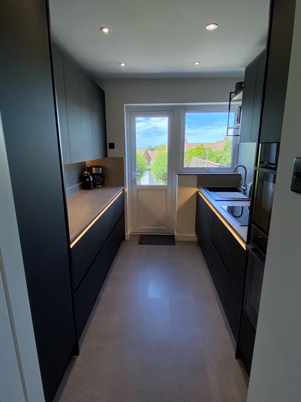Modern, sleek black finish kitchen